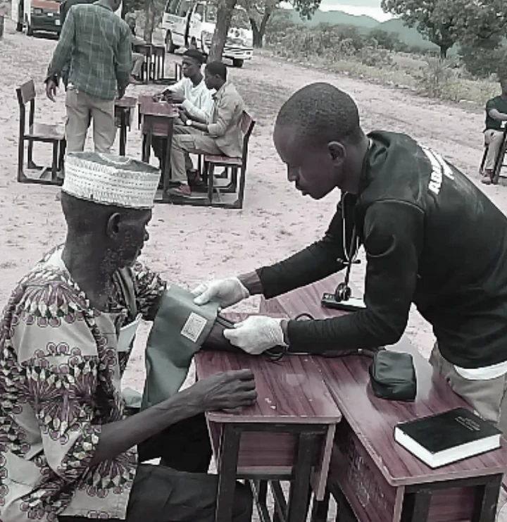 Clinician checking blood pressure