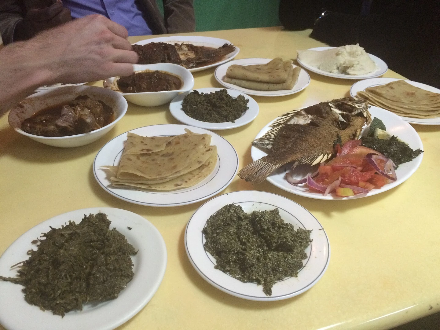 Kenyan meal with greens, beans and a maize staple
